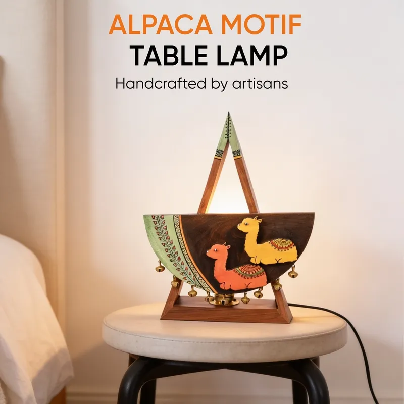 Wooden alpaca motif table lamp glowing on a round stool