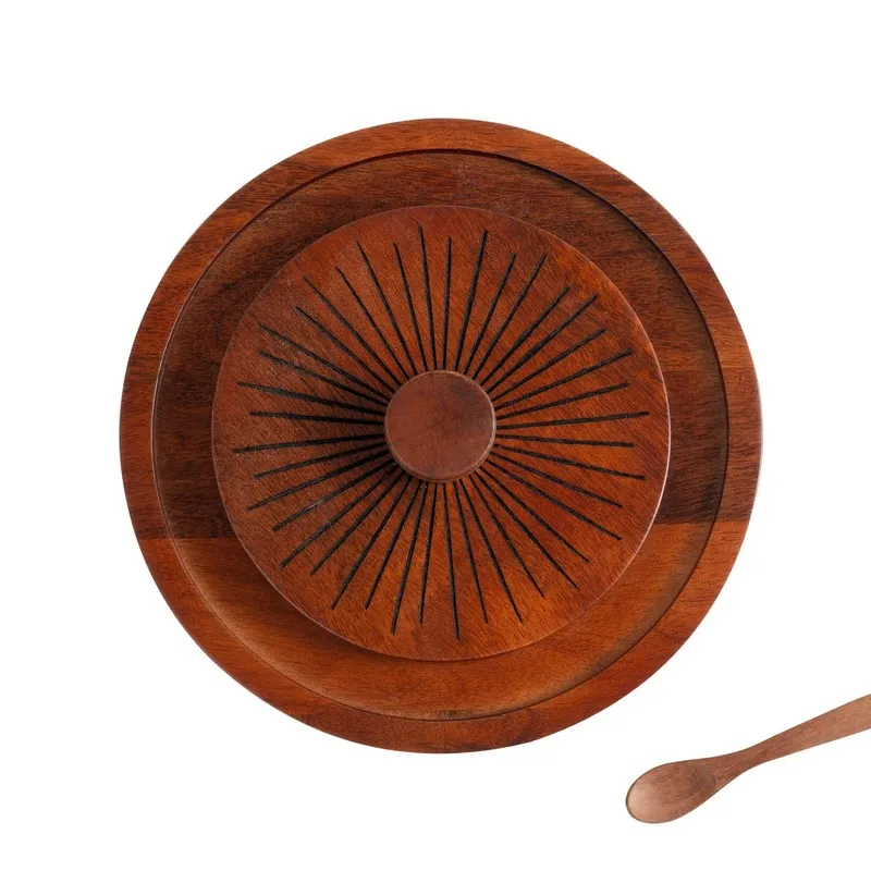Top view of brown wooden sunburst lid with a round central detail