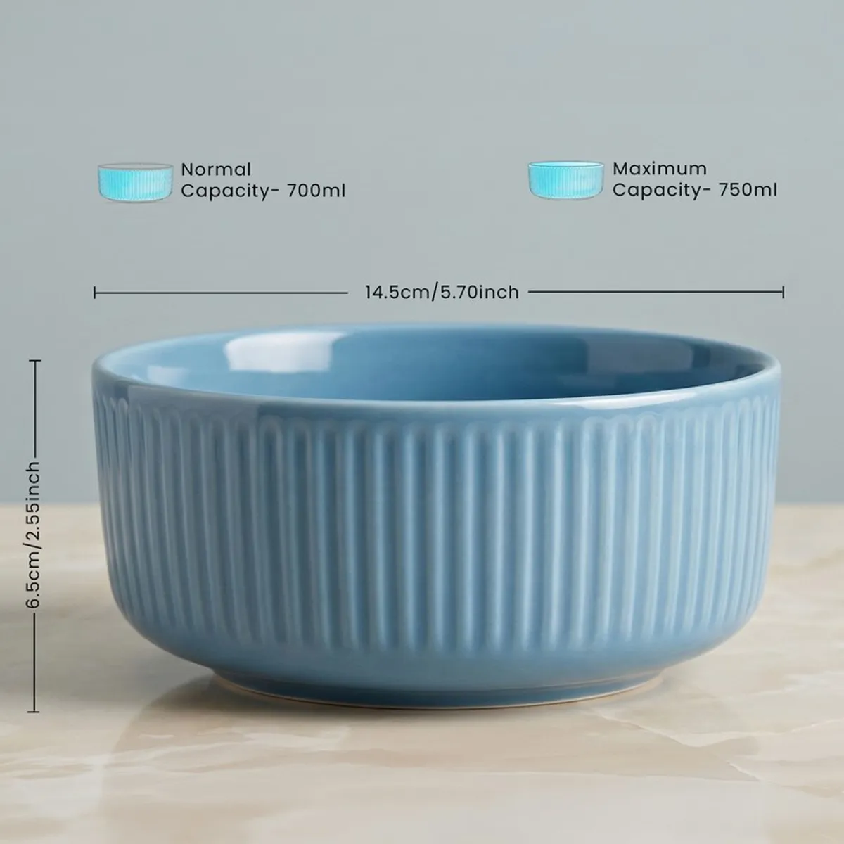 Blue round ribbed serving bowl shown from the side on a tabletop