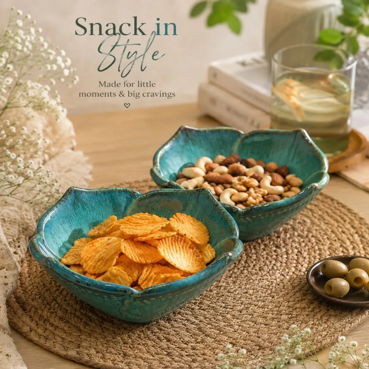Two green ceramic bowls filled with snacks on a woven dining mat
