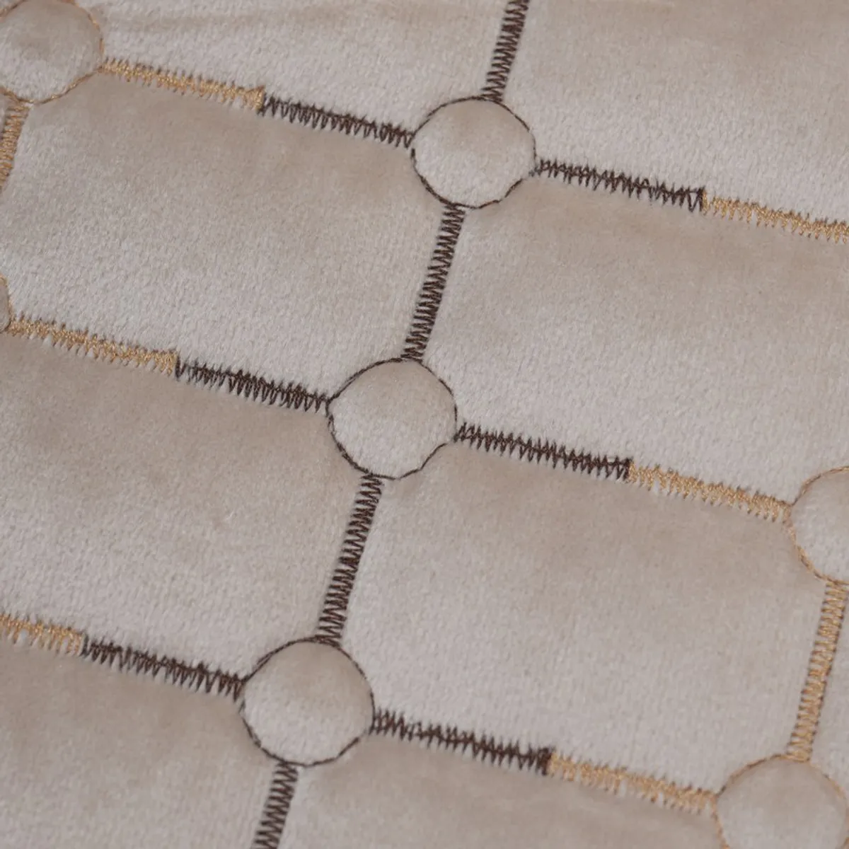 Close-up showing the beige cover's patterned top and textured underside