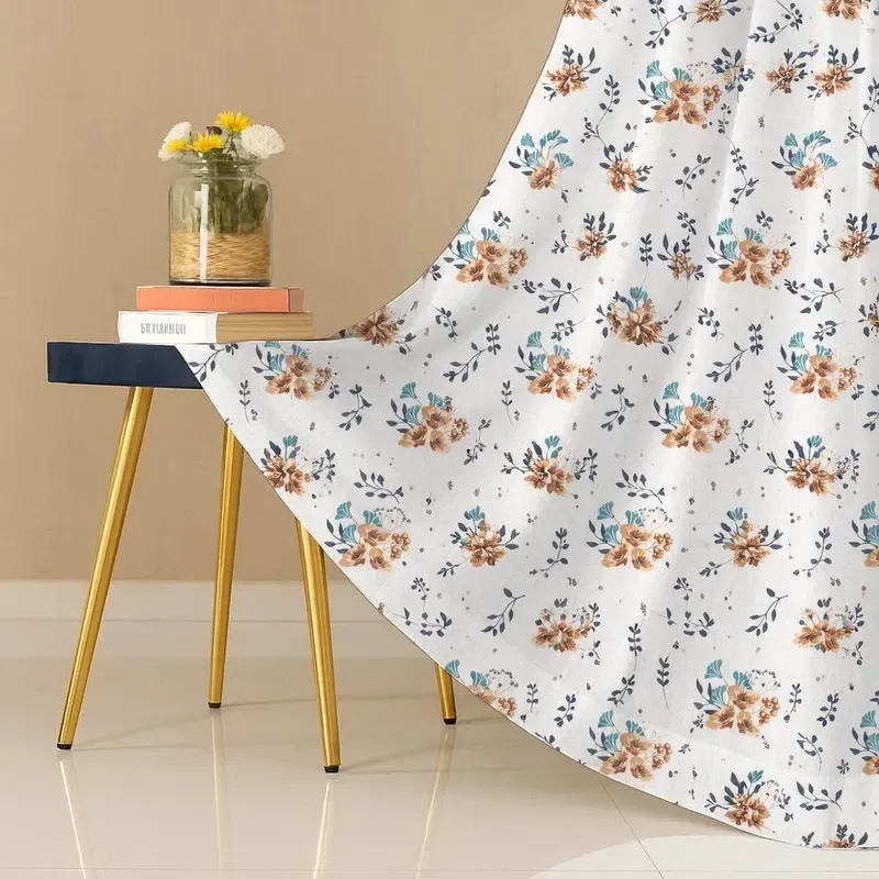 Close view of the floral printed curtain fabric in white, brown and blue
