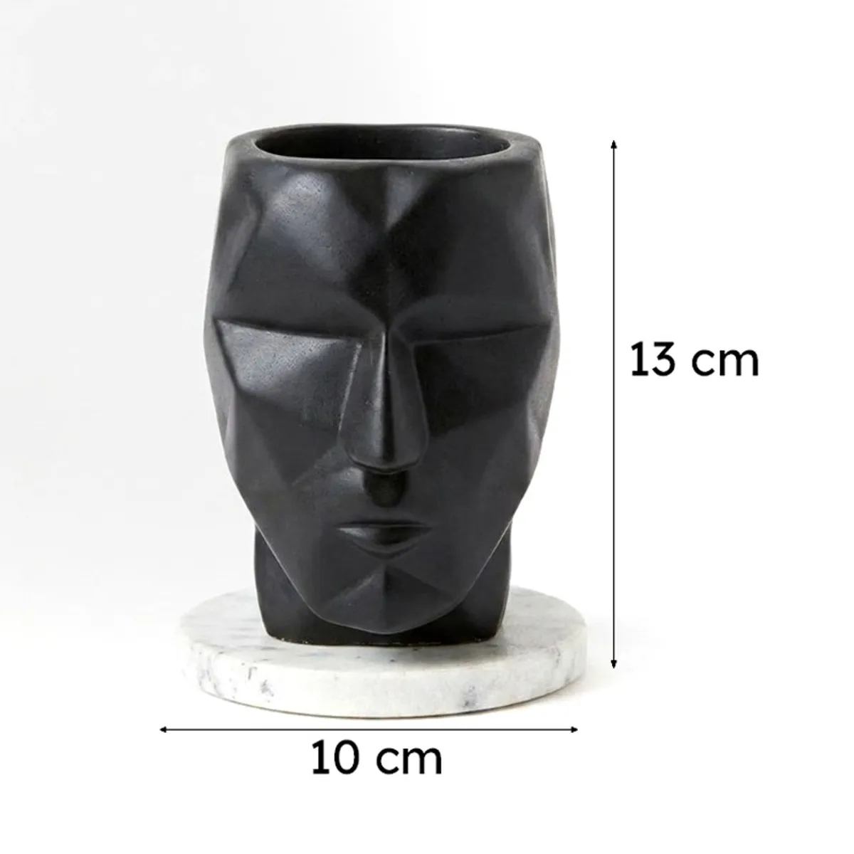 Black face-shaped planter on white base with visible height and width markers