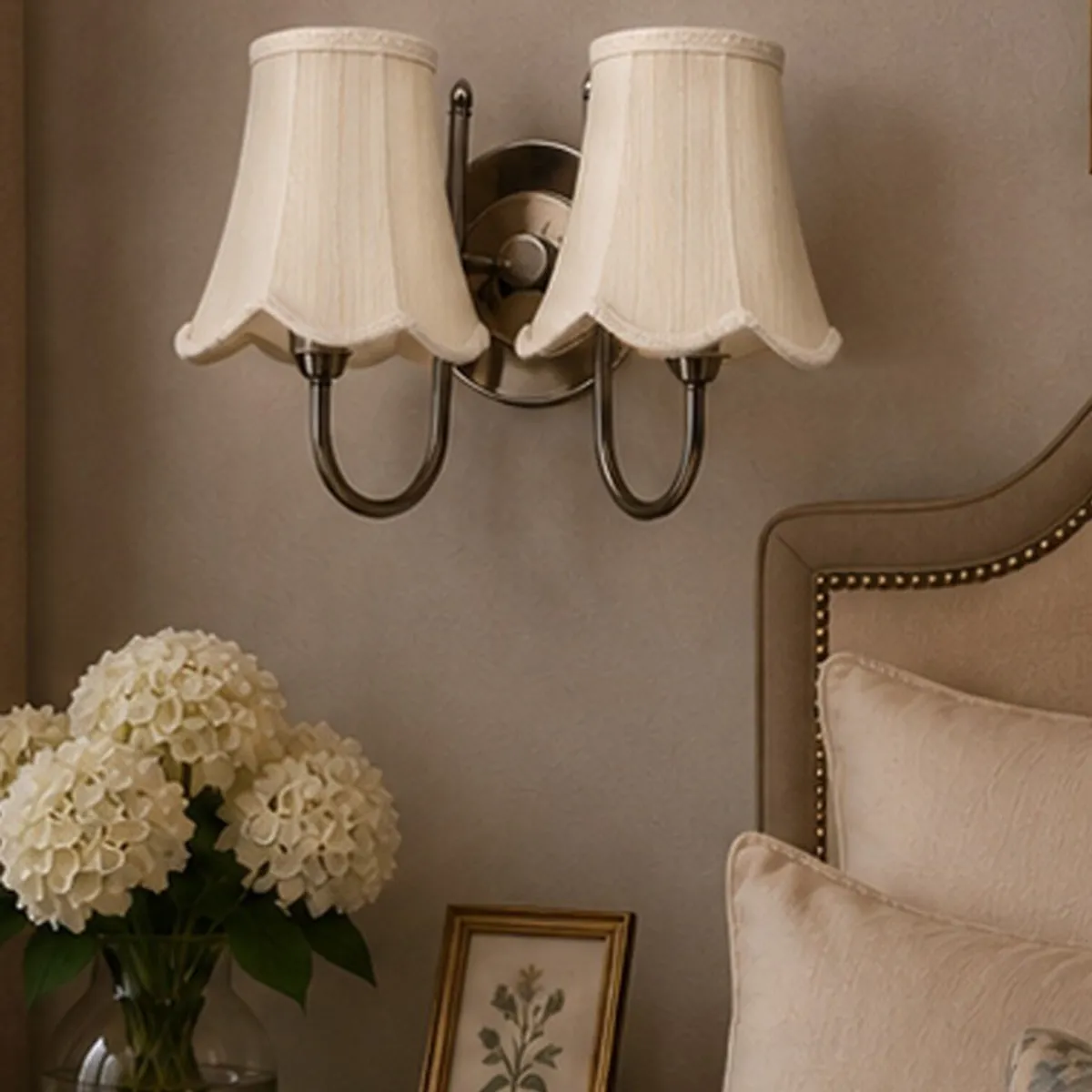 White double-shade wall lamp shown illuminated against a neutral wall
