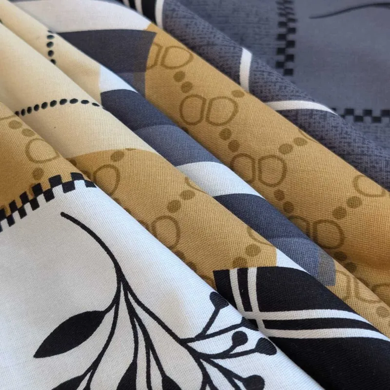 Folded fabric close-up showing botanical and geometric print details