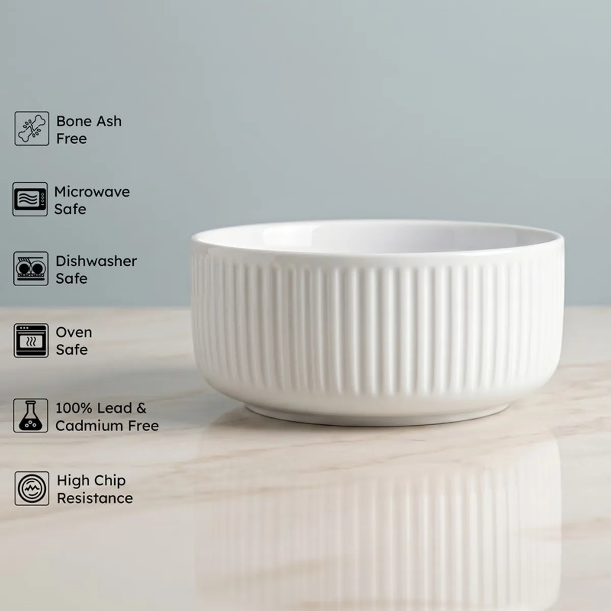 White ribbed serving bowl shown from the side on a tabletop