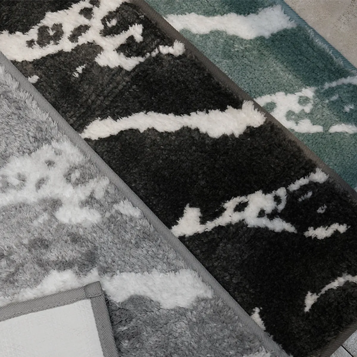 Close-up showing the textured edge and backing of the marble bath mat