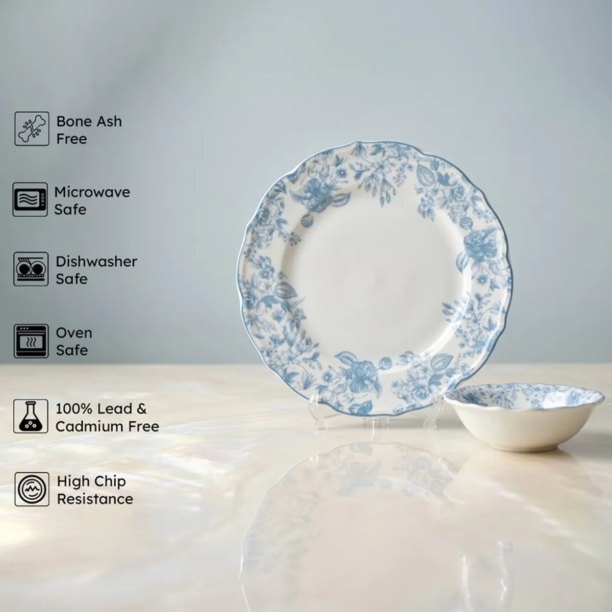 Blue and white floral porcelain plate and bowl on display stands