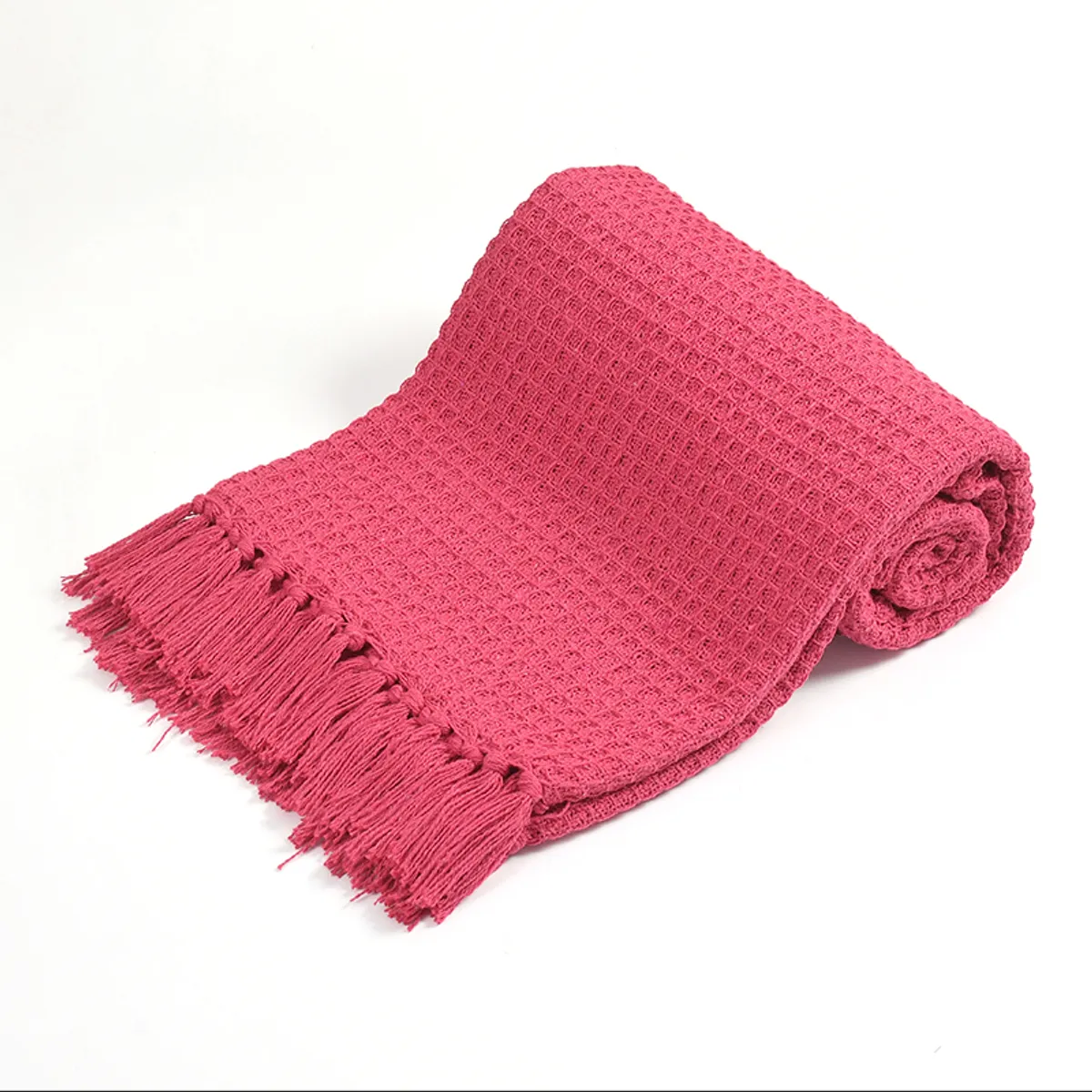 Rolled bright pink waffle throw with fringe detail