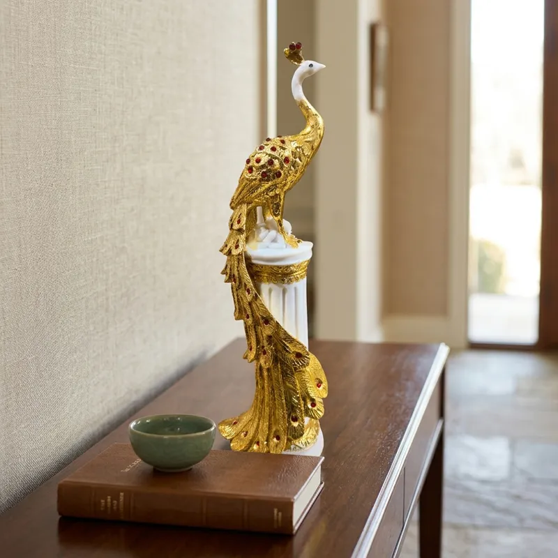 Tall gold and white decorative showpiece placed on a console table
