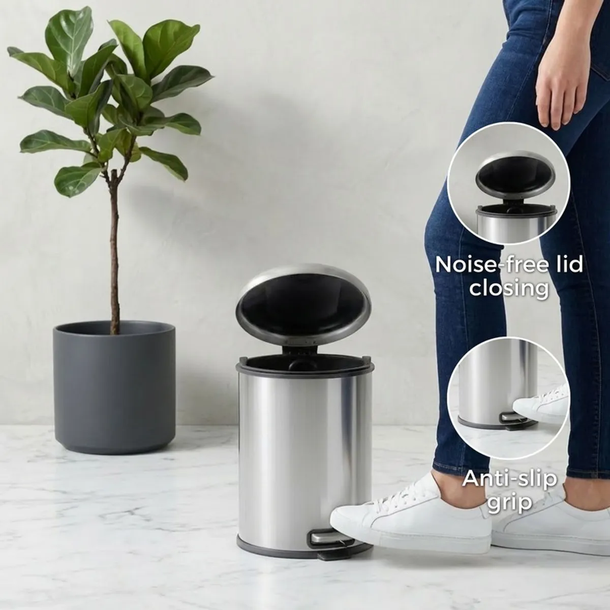 Silver pedal dustbin shown with open lid beside a person