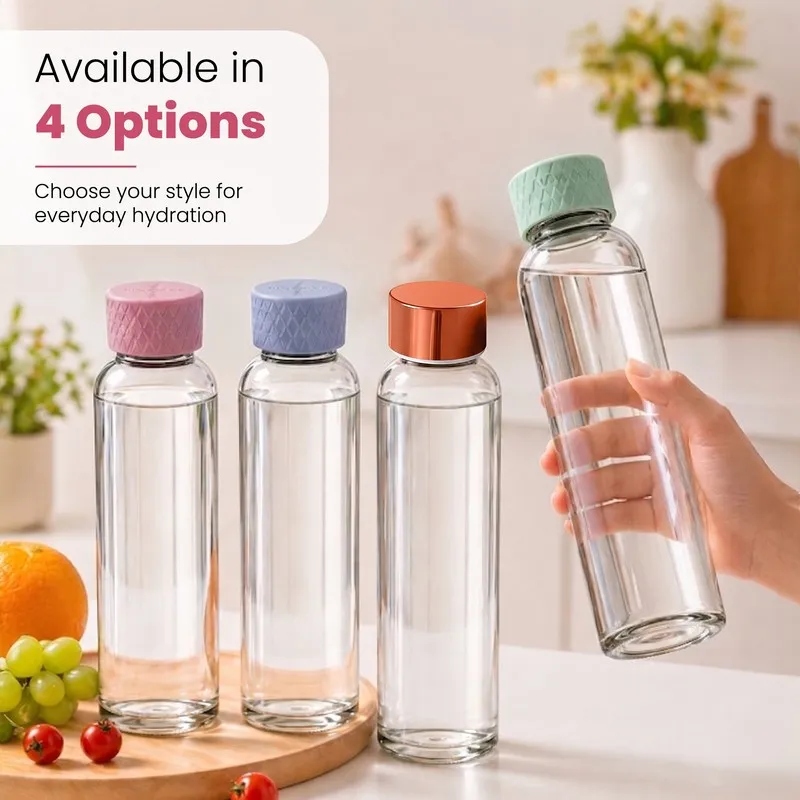 Four transparent glass bottles with colourful caps arranged together.