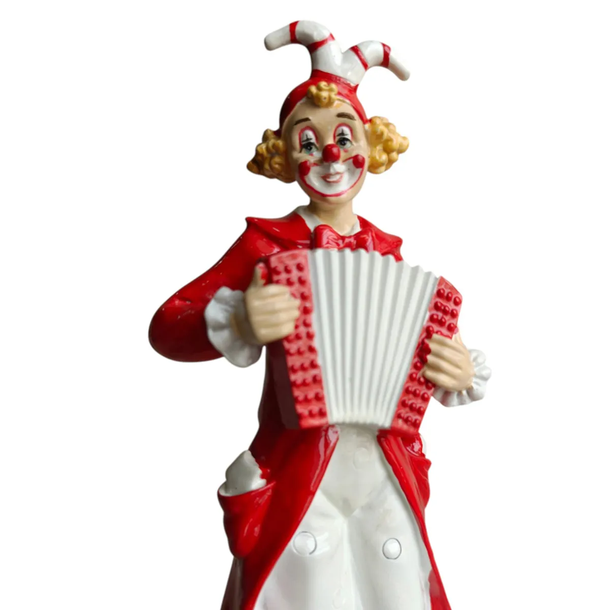 Close-up of the clown's expressive face and red and white accordion