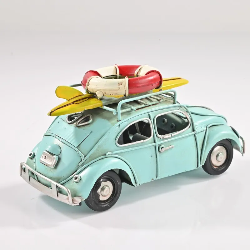 Blue retro beach car iron showpiece on a white background