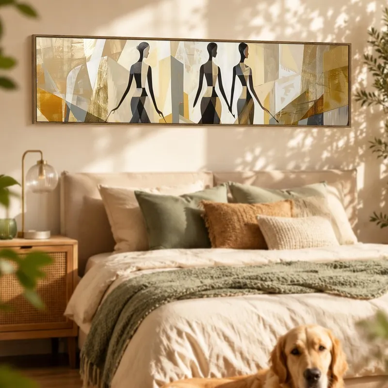 Framed abstract silhouette wall art above a bed in a warm, earthy bedroom