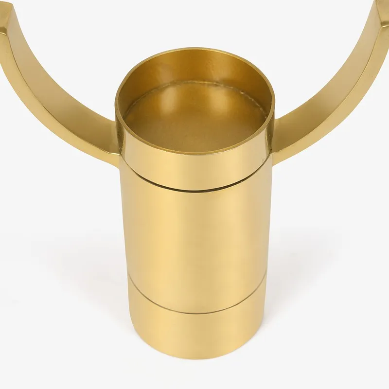 Close-up of the gold candle cup and base of the holder