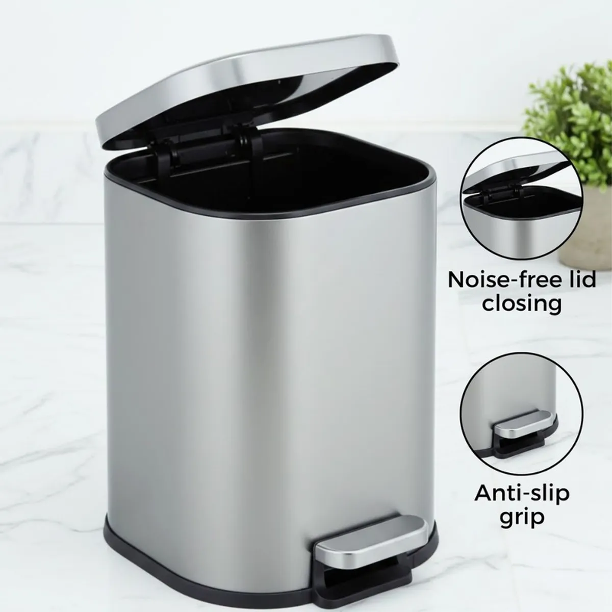 Open grey metal pedal dustbin with black interior and foot pedal