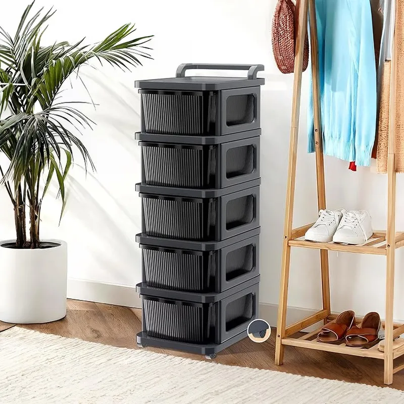 Five-tier black and grey drawer rack with wheels shown in a room setting.