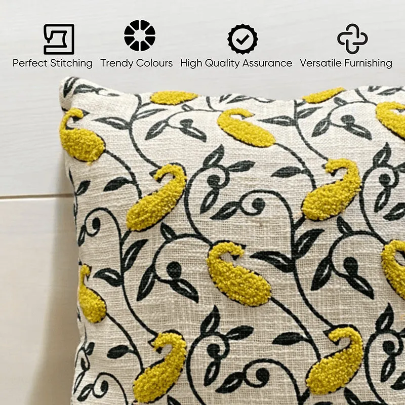 Close-up of yellow paisley cushion cover with black vine pattern