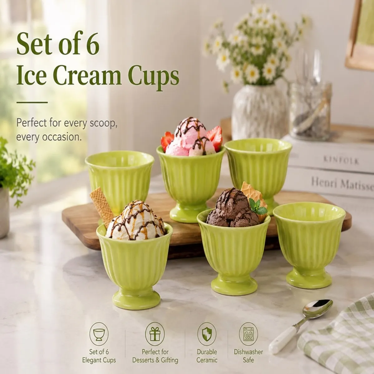 Six green footed ice cream cups arranged on a dining table with dessert.
