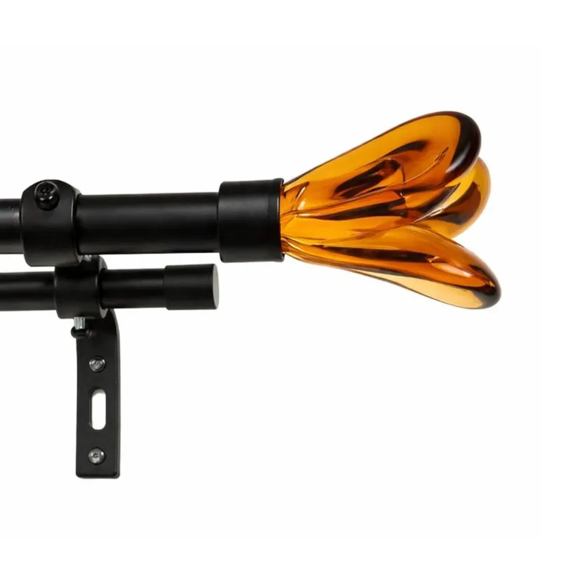 Close-up of black curtain rod with glossy amber-brown tulip finial and bracket