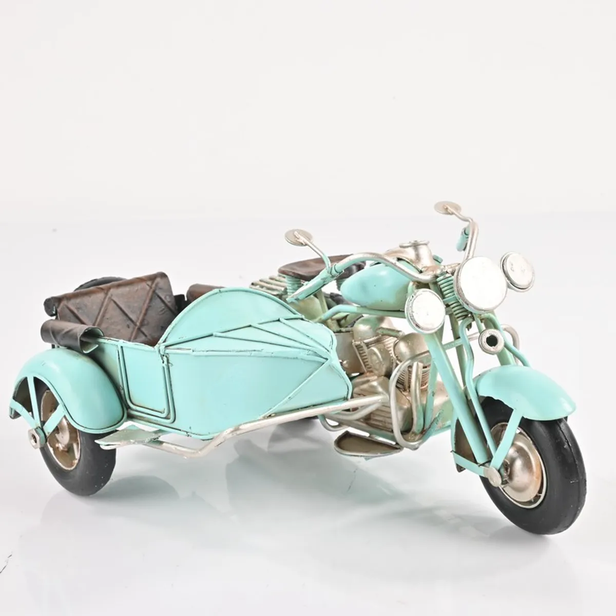 Blue iron motorcycle sidecar showpiece on a white background
