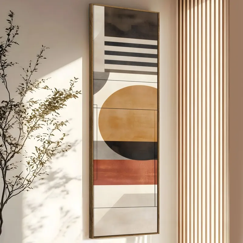 Vertical view of framed geometric canvas art in earthy tones against a neutral wall