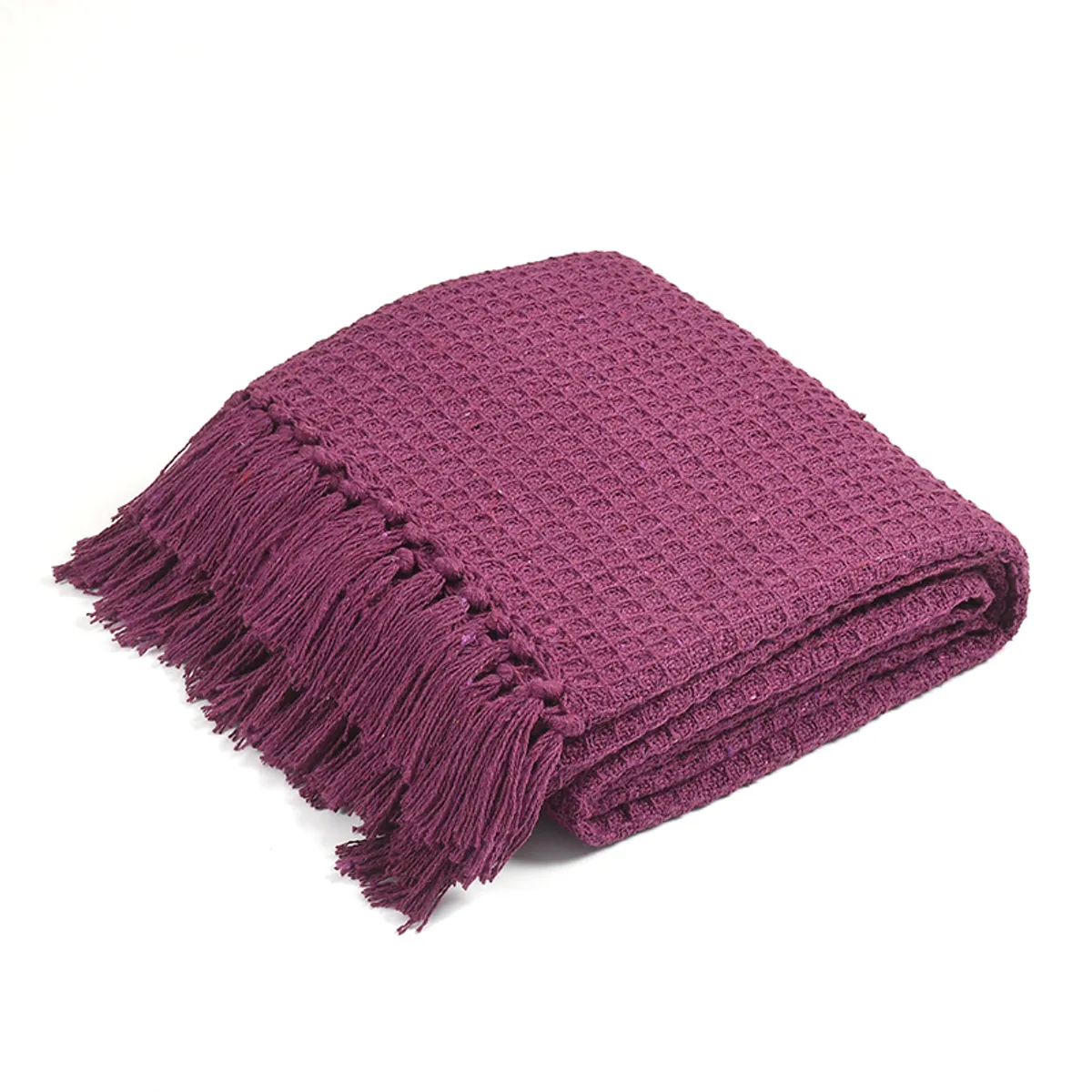 Folded purple waffle throw with fringe detailing on a white background