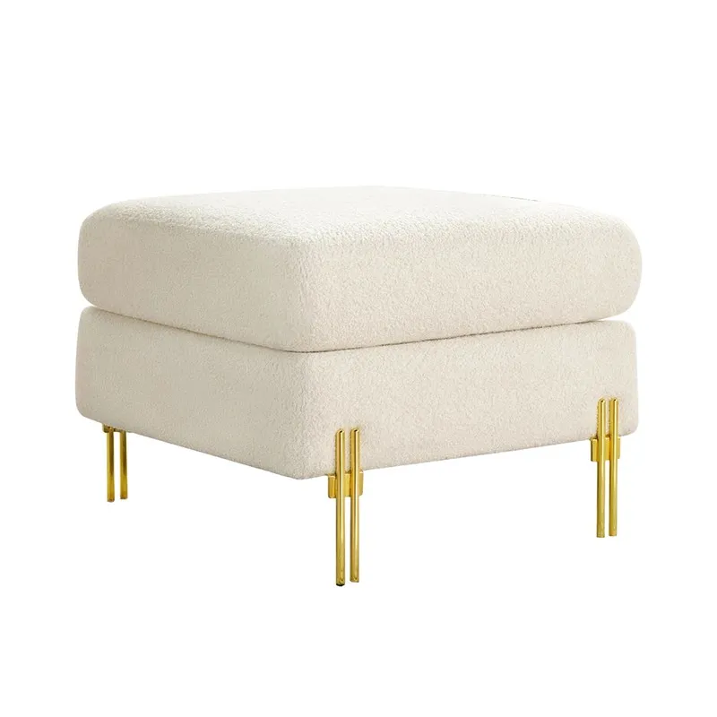 White square ottoman with rounded edges and gold metal legs