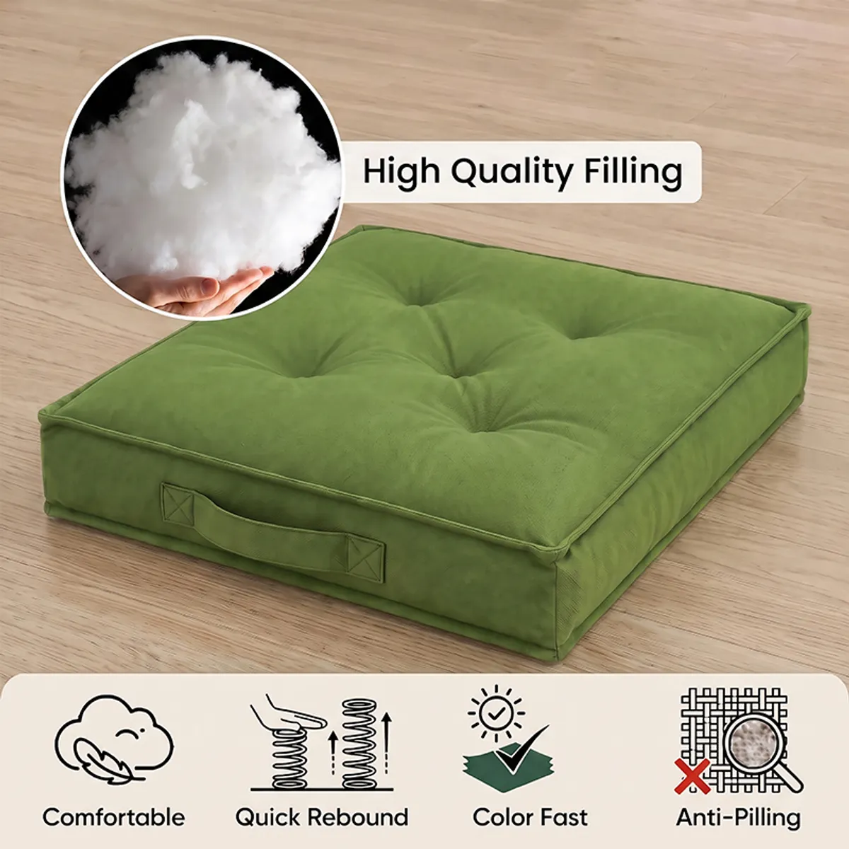 Close-up of a green floor cushion with tufting and side handle