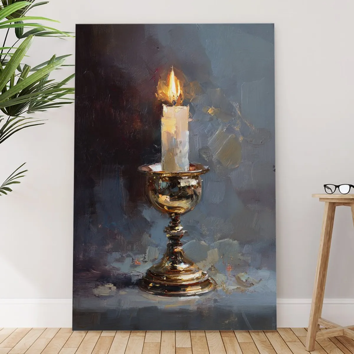 Tall canvas painting of a lit candle in a brass candlestick leaning against a wall