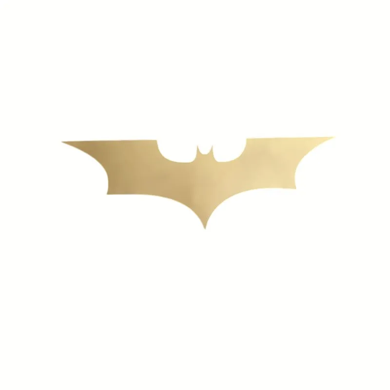 Gold Batman-shaped wall accent on a white background
