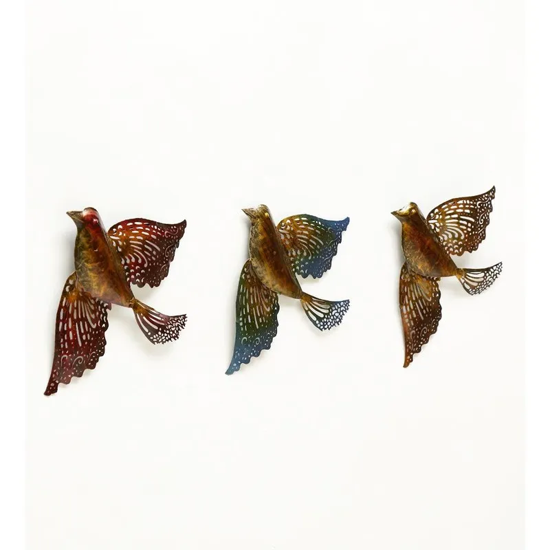 Set of three multicolour bird wall accents on a white background