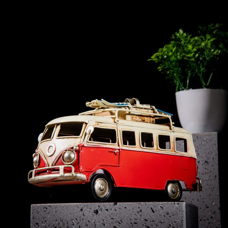 Red and ivory caravan decor showpiece displayed on a dark pedestal
