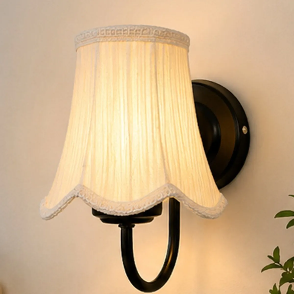 Close-up of the white cotton shade and black circular wall mount
