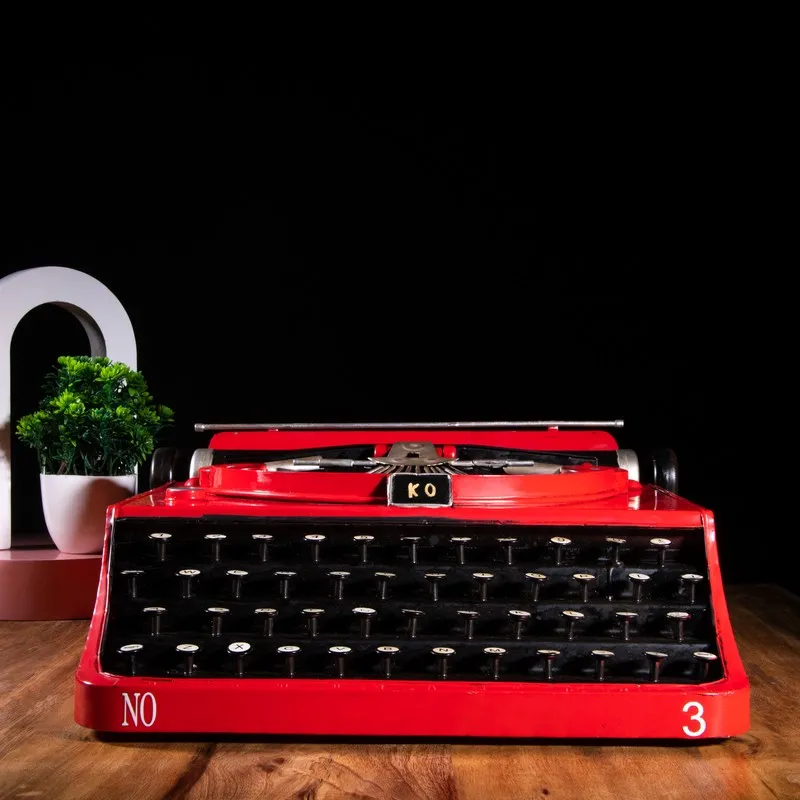 Front view of a red and black typewriter showpiece
