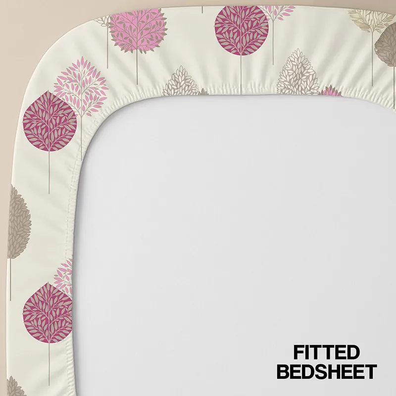 Close-up of fitted bedsheet corner in pink and beige botanical print