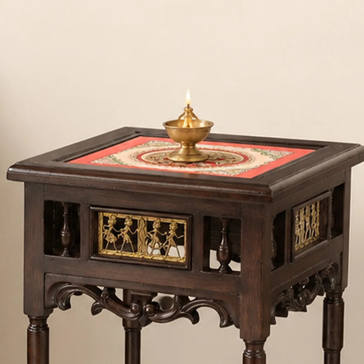 Close-up of the square top and carved detailing on the wooden side table