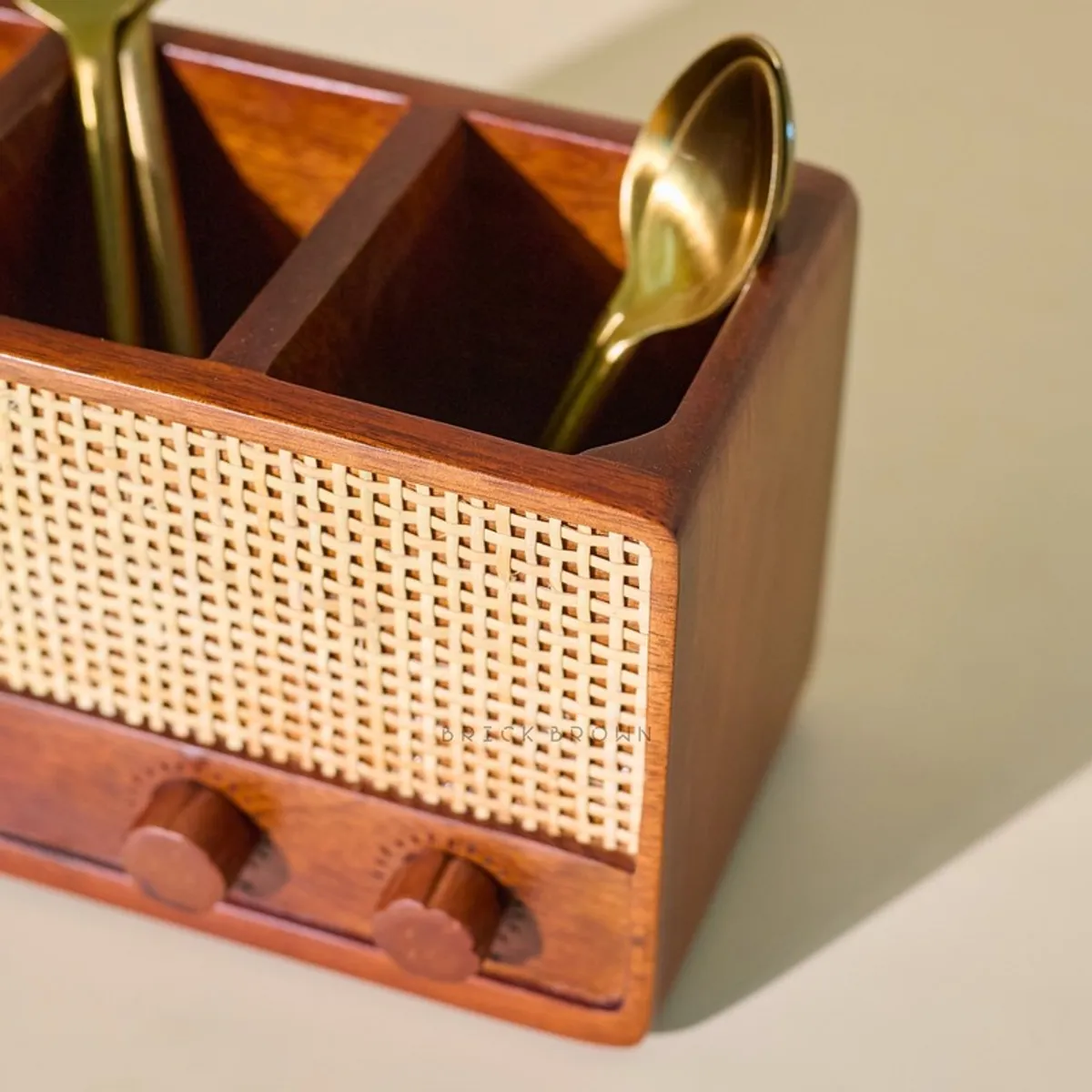 Close-up of wooden cutlery stand corner with woven front panel