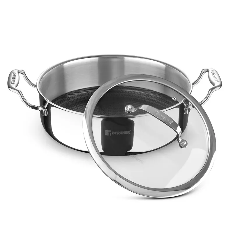 Open silver casserole with patterned interior and glass lid