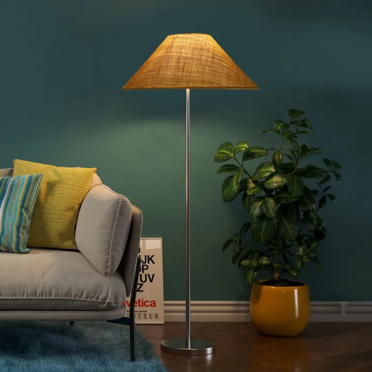 Yellow jute floor lamp lit in a teal room beside a sofa and potted plant