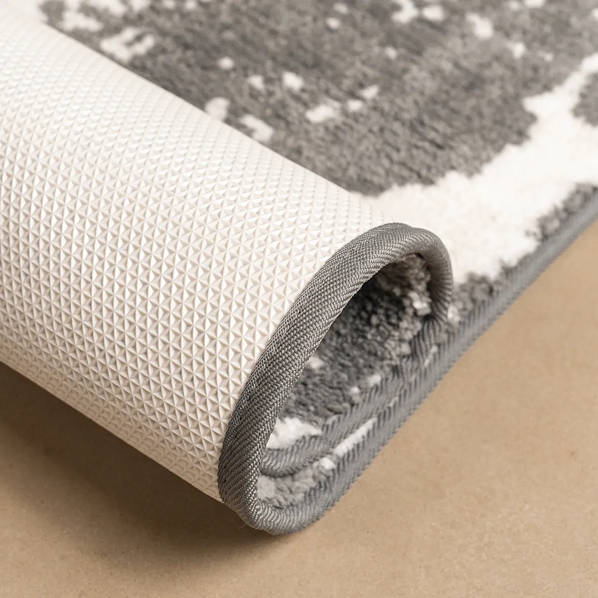 Rolled runner rug showing its textured surface and anti-skid backing