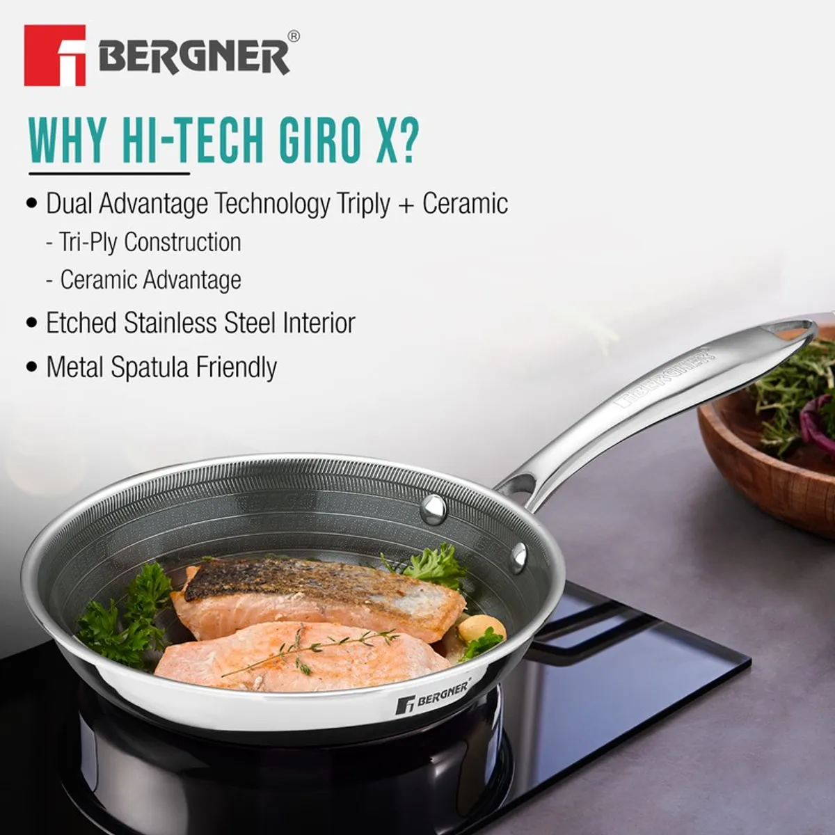 Silver frying pan with cooked fish and ceramic coating feature graphic