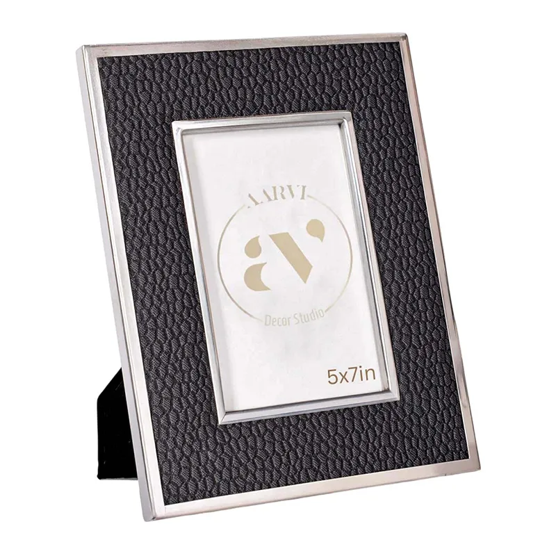 Angled view of black textured photo frame with metallic border