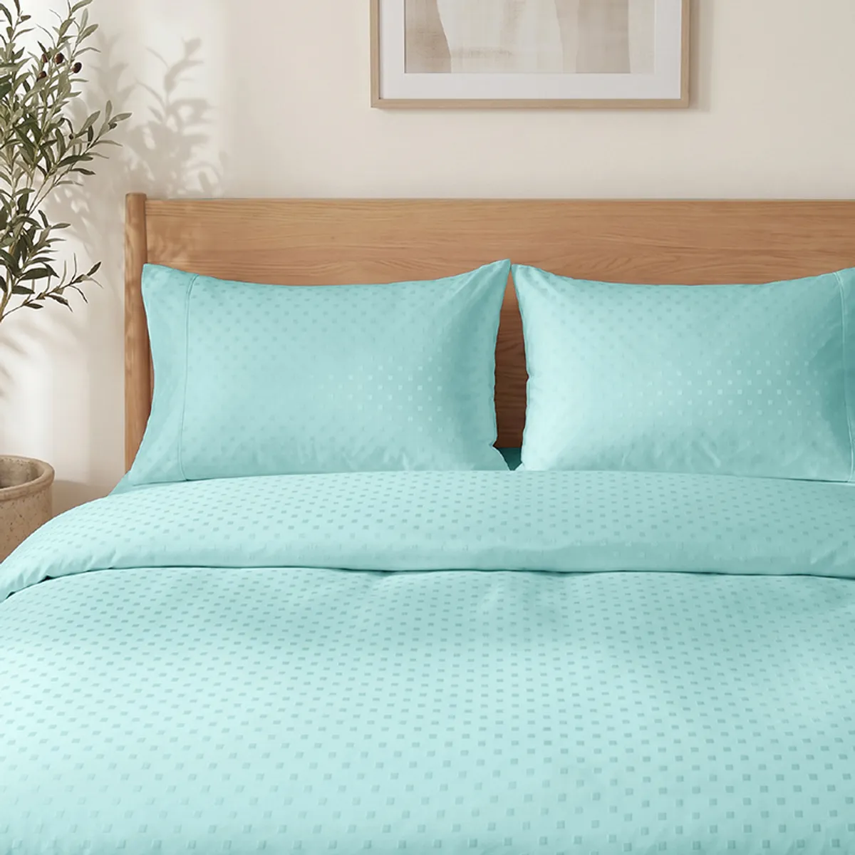 Pale turquoise duvet cover showing its subtle geometric dot texture