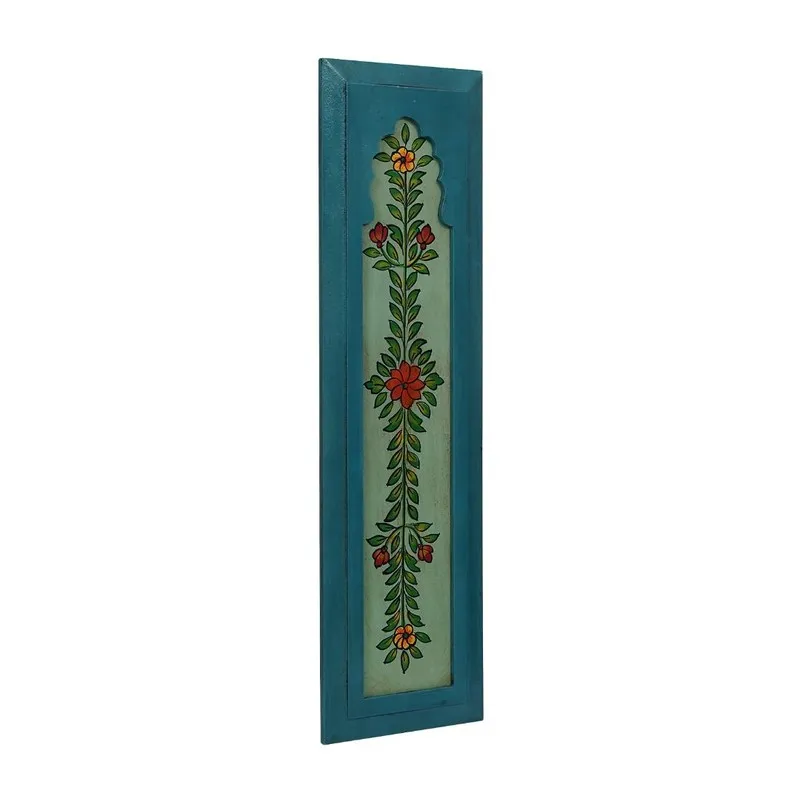 Angled view of blue rectangular wall accent with painted botanical design