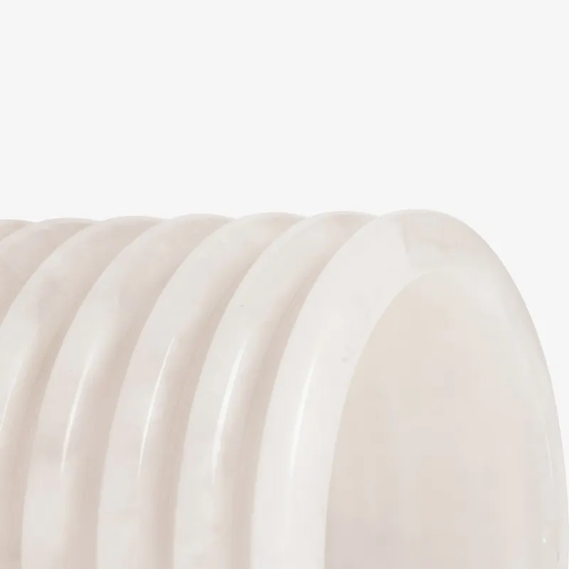 Close-up angled view of the smooth opening and ribbed shade