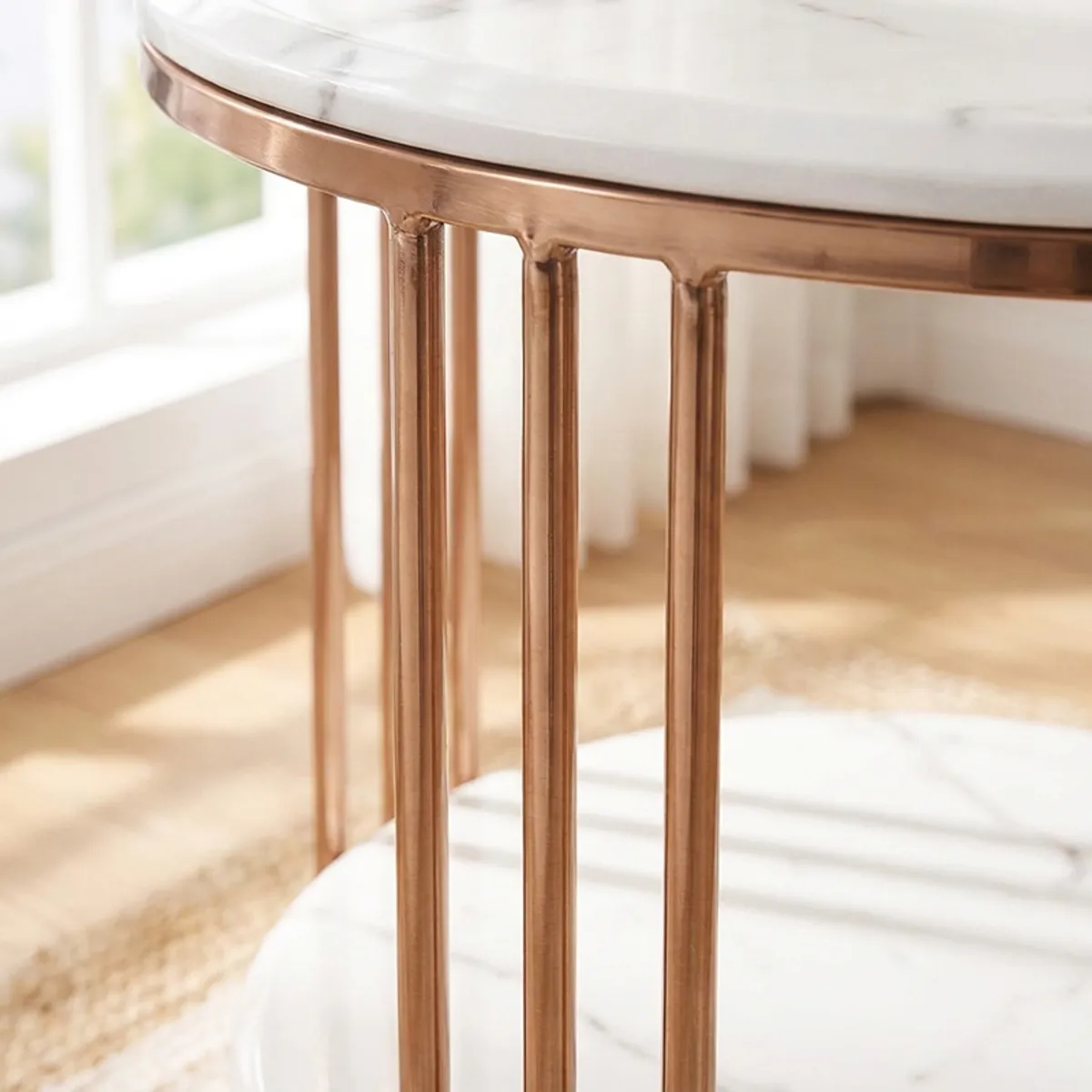 Close-up of the glossy white marble top and gold stainless steel frame