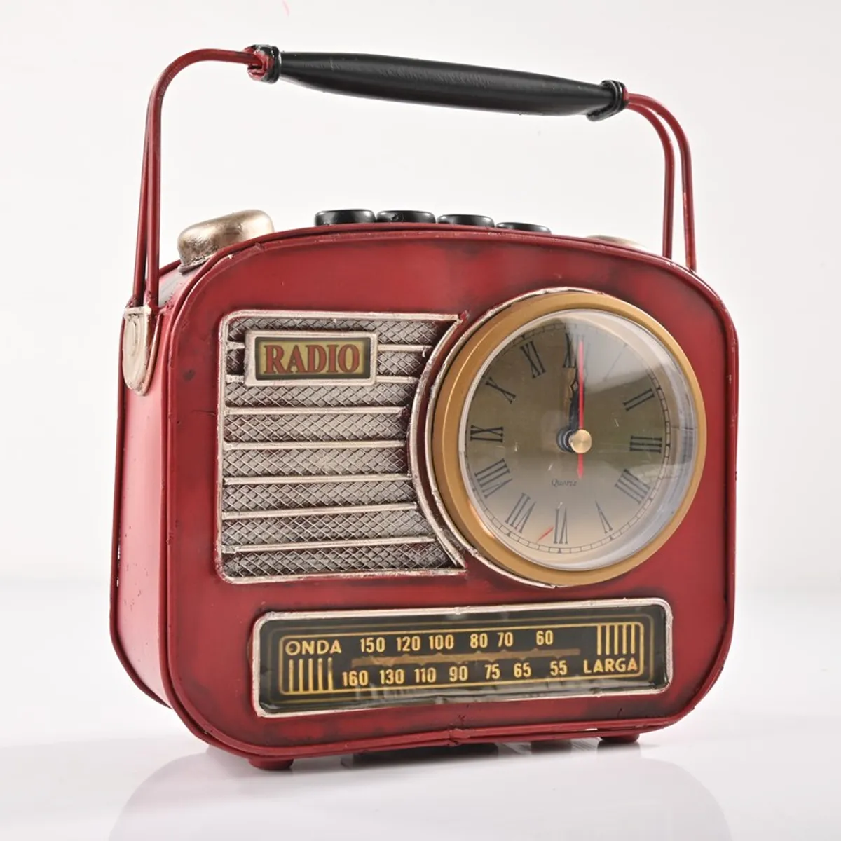 Red retro radio-inspired iron showpiece with clock against a white background