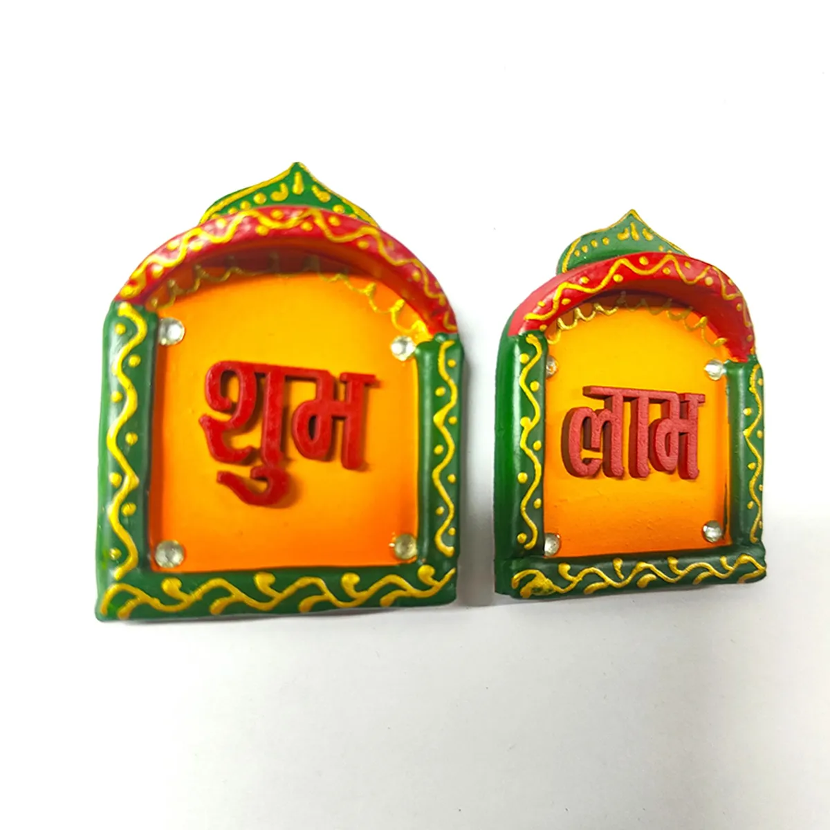 Close view of two colourful Shubh Laabh wall accents